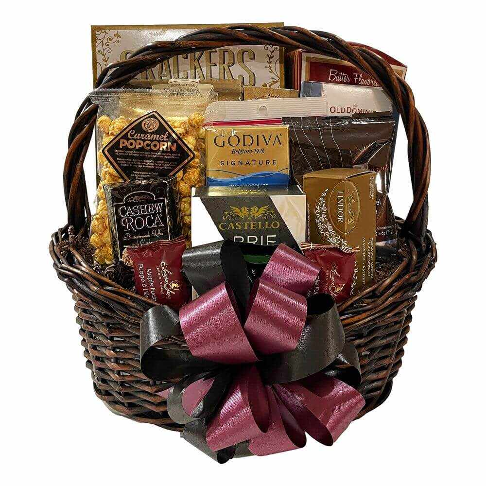Express Gift Basket with assorted gourmet treats including caramel popcorn, Godiva chocolates, Brie cheese, cashew roca, and crackers in a wicker basket with decorative bow