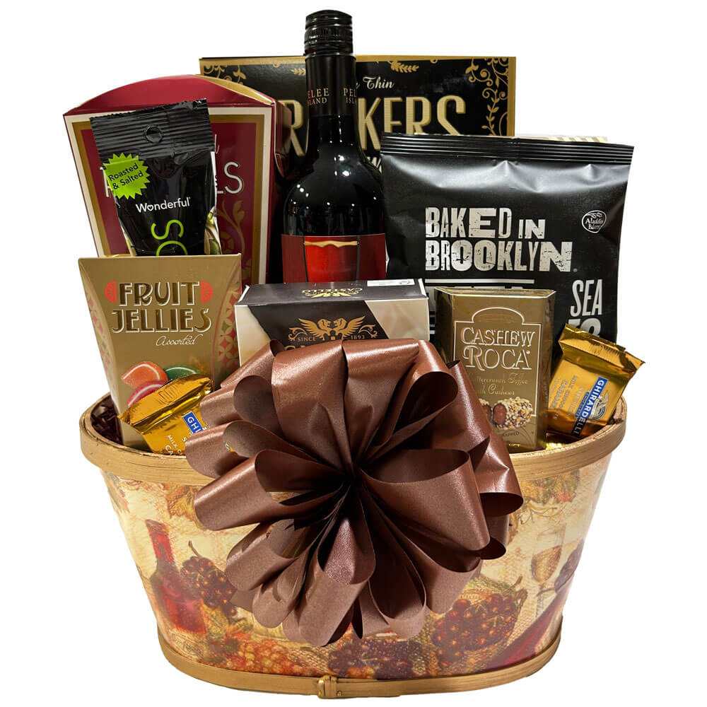 Luxury gift basket with wine, brie cheese, fruit jellies, snacks, and chocolates in a decorative wicker basket