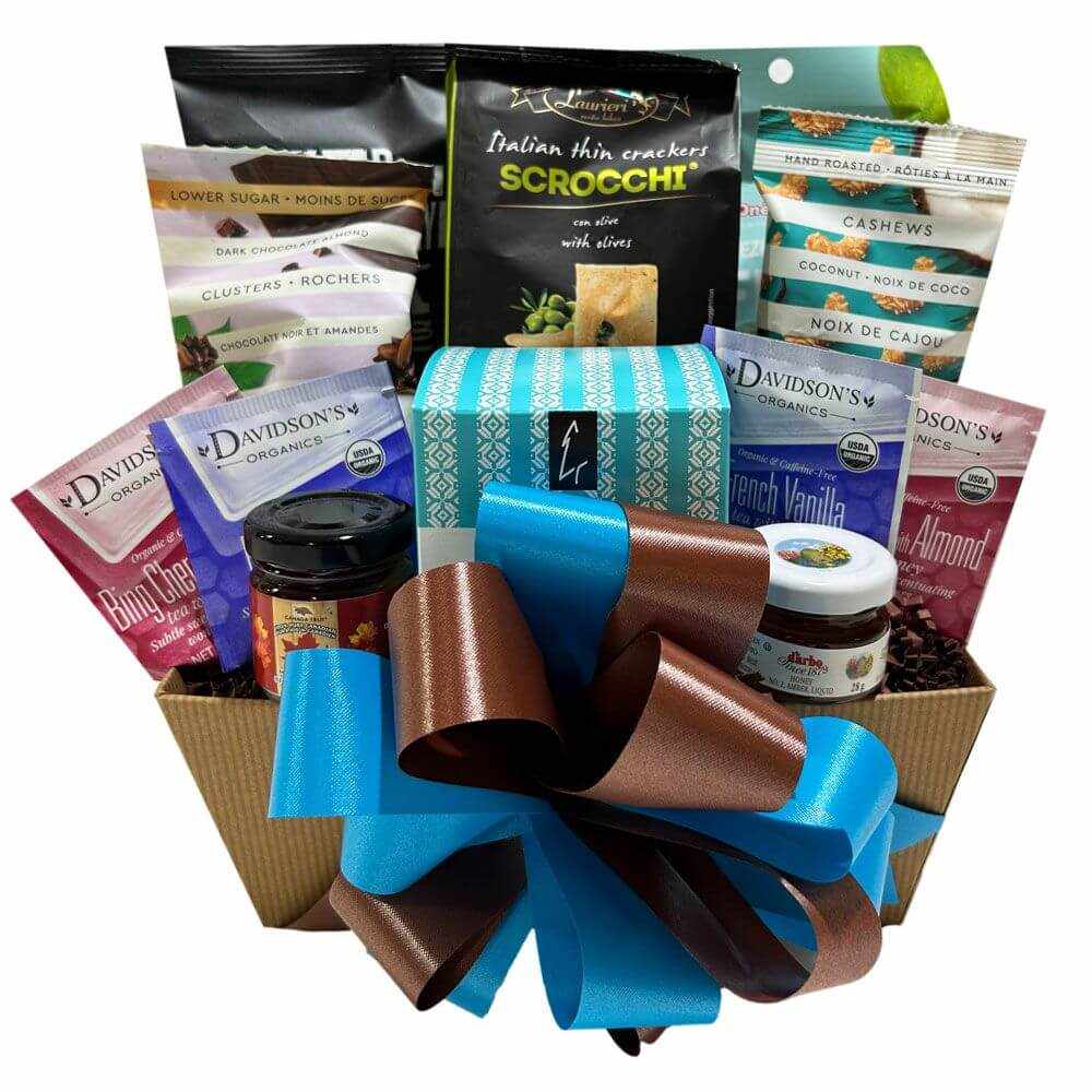 Natural Gift Basket with gourmet treats including shortbread cookies, honey, maple butter, herbal teas, nuts, olive thins, chocolate mix, and fruit snacks in an elegant natural-colored gift box