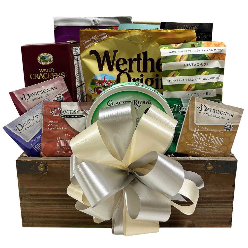 Sugar free gift basket with Russell Stover chocolates, Werther’s caramels, Davidson’s herbal tea, Cherrington crackers, pistachio nuts, dried fruit, hot chocolate, mini pretzels, and white cheddar spread in a fabric basket