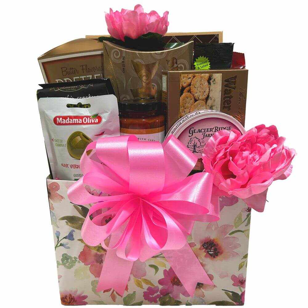 Special Things Gift Basket with floral box, pink bow, sugar cookies, maple nougat, pistachios, cheese, crackers, olives, smoked salmon, and pretzels.