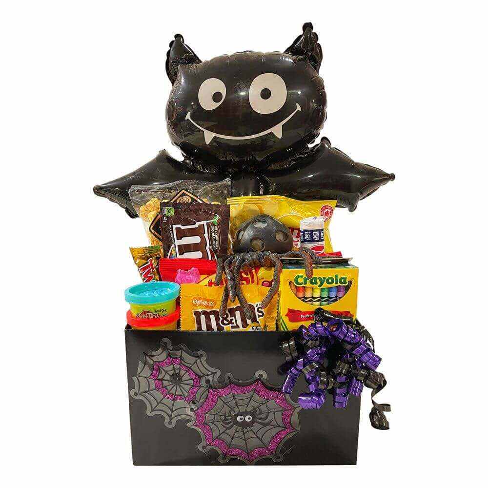 Halloween Spooktacular gift basket with treats, toys, crayons, and spooky decorations