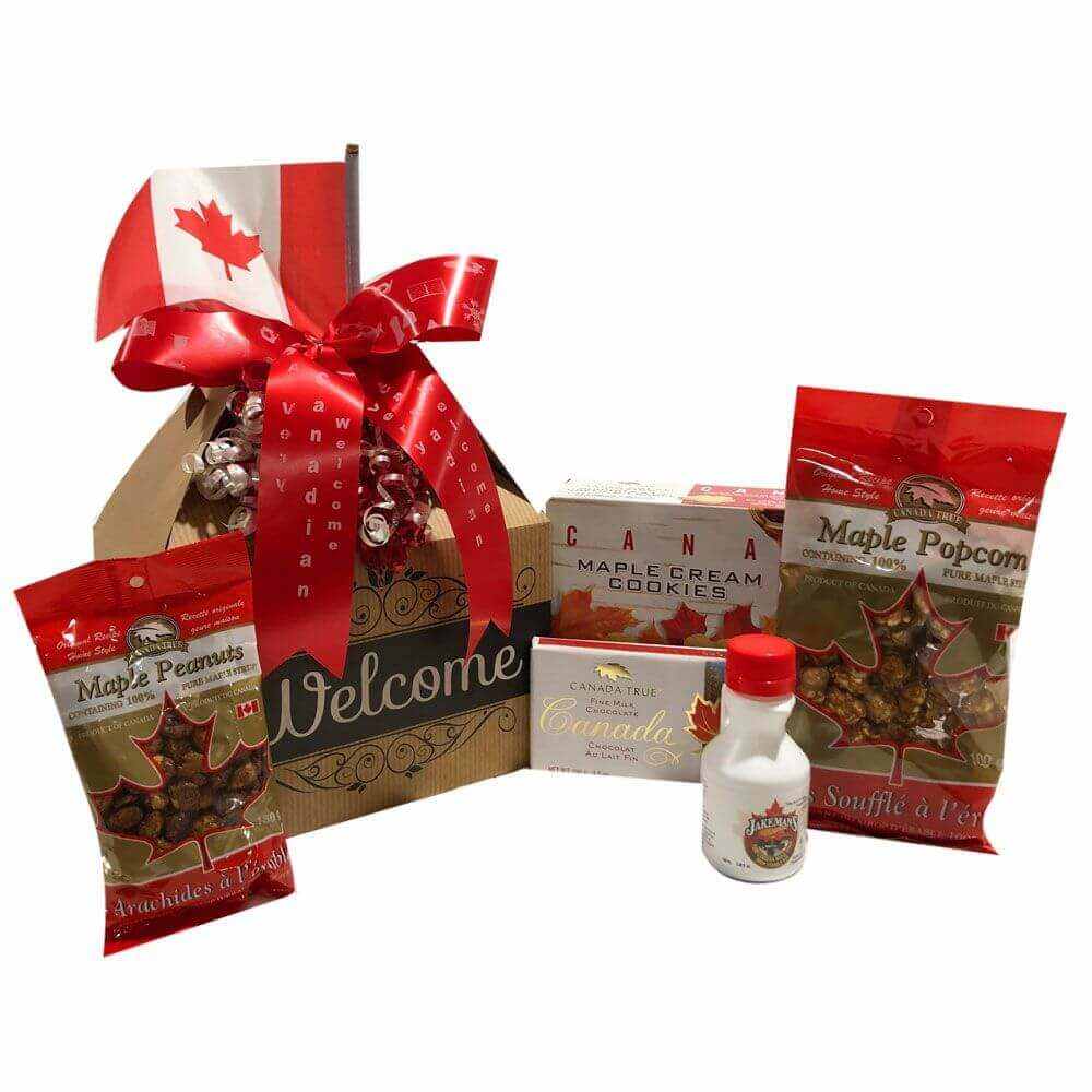 Canadian Gift Basket with maple popcorn, syrup, peanuts, fudge, cream cookies, and Canadian flag welcome gift pack