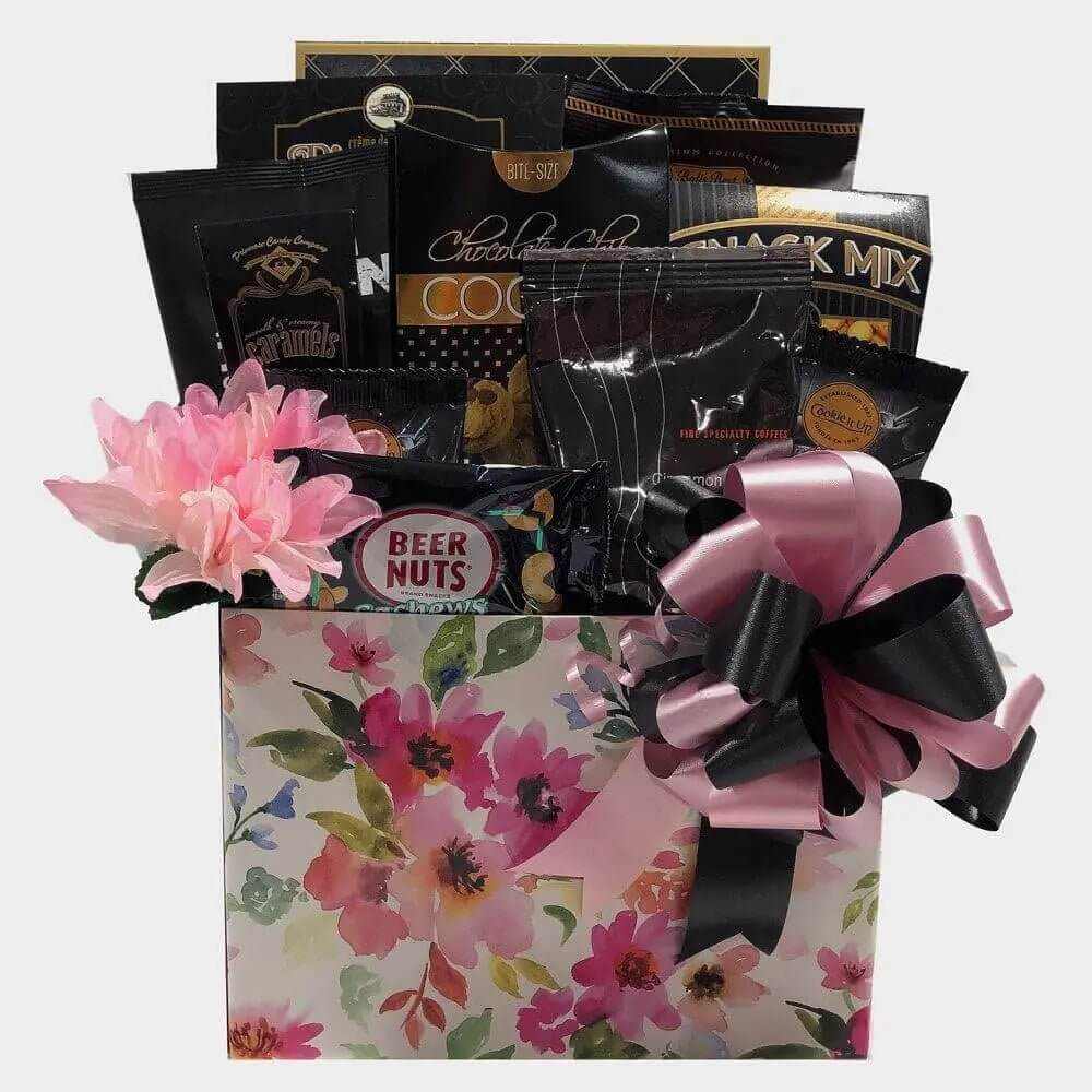 Artisan Gift Basket with gourmet snacks, pink flower, and decorative bow in floral box