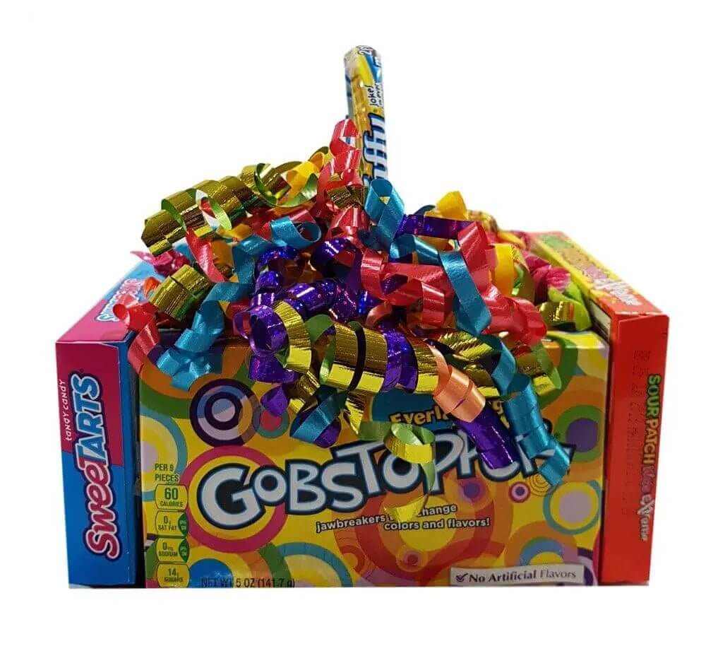 Candy basket made from theater-size candy boxes with colorful ribbons including Sweetarts, Gobstopper, and Sour Patch candies