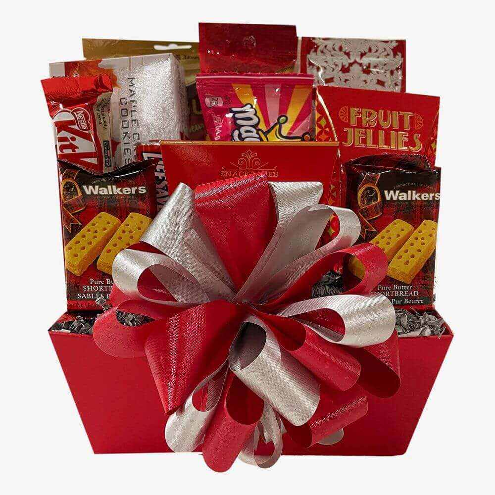 Celebrate Gift Basket with assorted candies, chocolates, cookies, and fruit jellies in red gift box with decorative bow