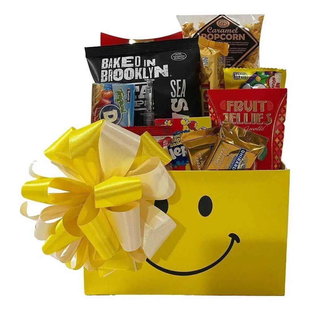 Get Well Soon Gift Basket with snacks including caramel popcorn, fruit jellies, cookies, chocolates, and a smiley face box with yellow bow