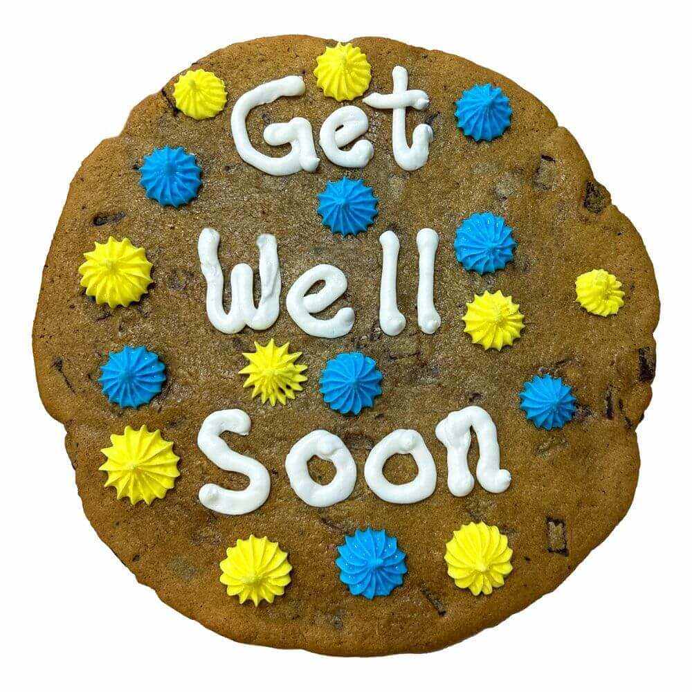 Giant chocolate chunk cookie with "Get Well Soon" icing and colorful blue and yellow decorations