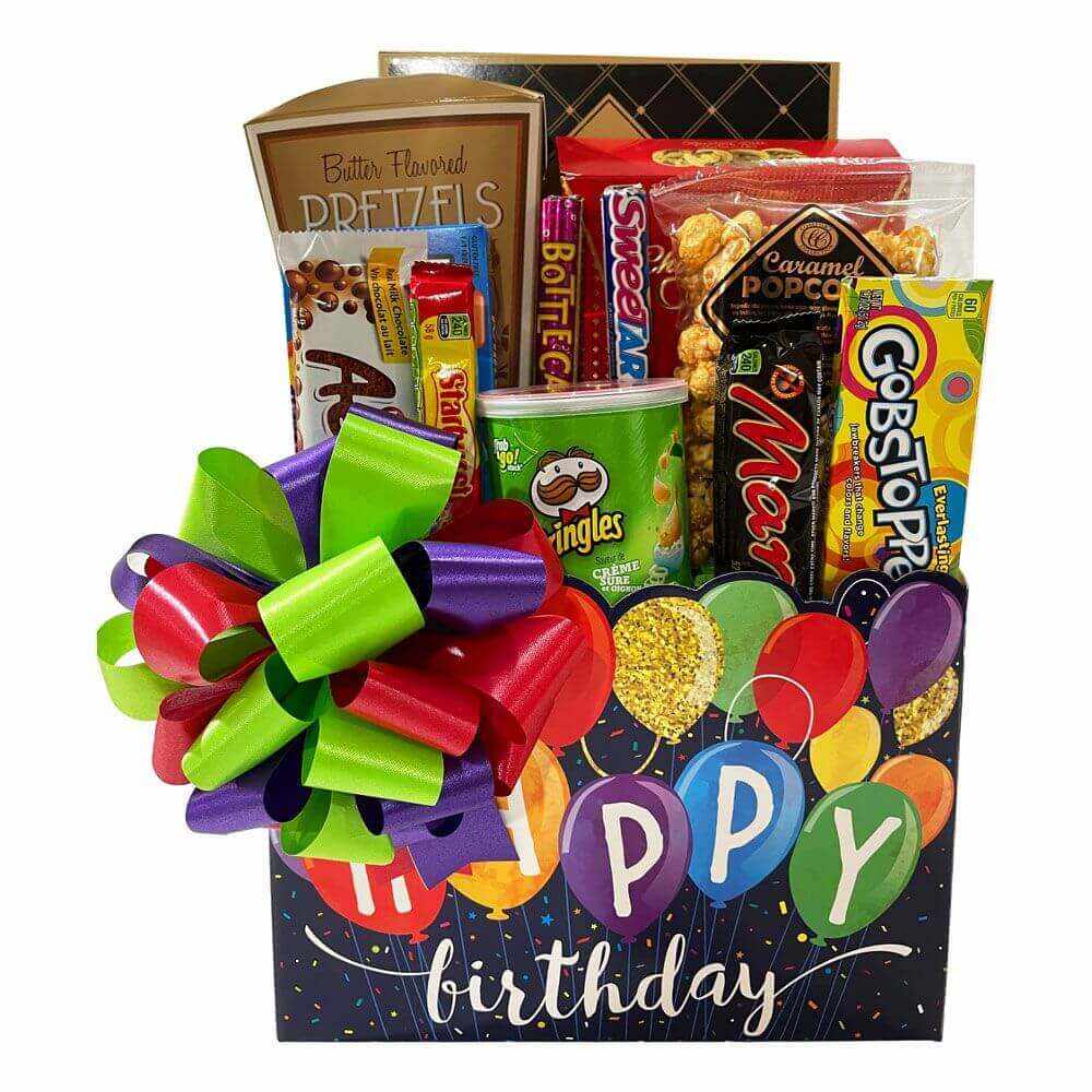 Birthday gift basket with popcorn, pretzels, cookies, candy, chocolate, and colorful bow on festive box